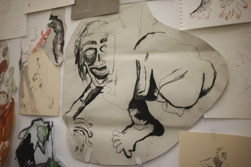 A figure is collaged together and drawn with charcoal, and stuck to the wall of Cindy Phenix's studio with tape.