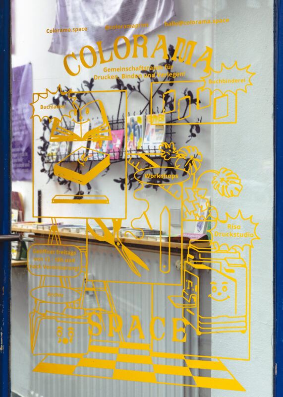 Glass doorway for Colorama, in yellow ink and featuring an illustration of the project space.